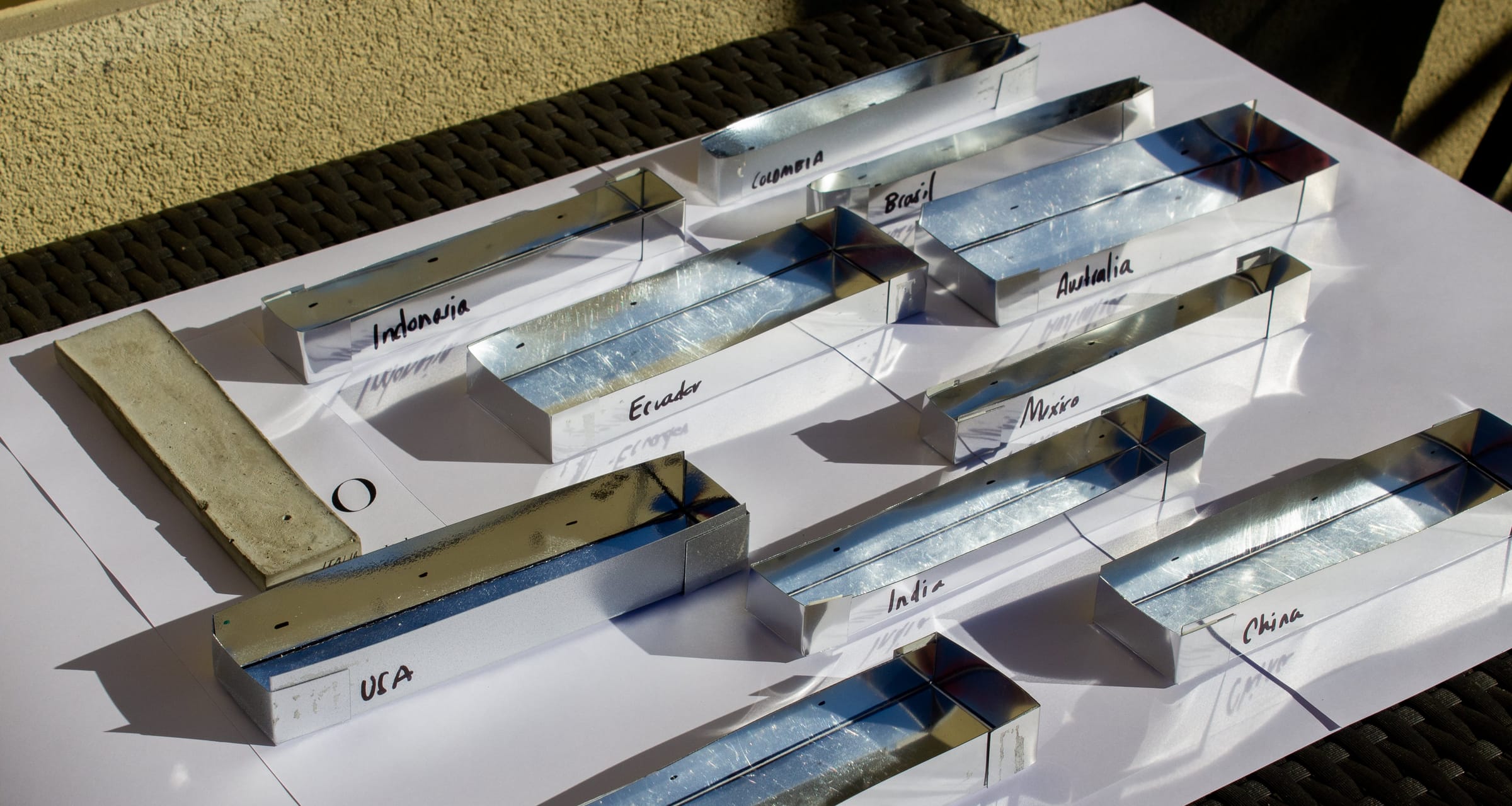 Metal moulds labelled with each country's name